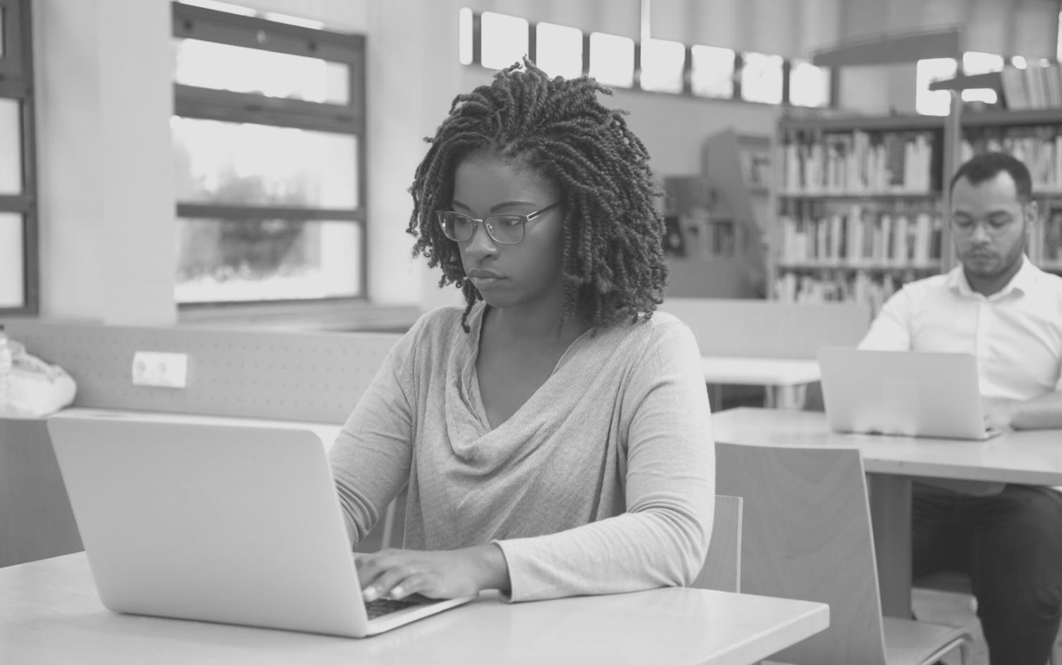 Finance professional reviewing organized budget documentation files